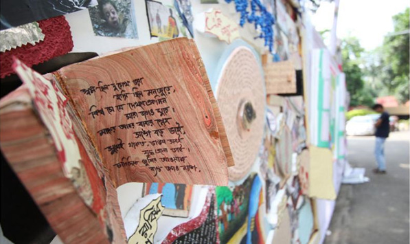 A poem written by a participant and a glance of wall magazine Source: The Independent